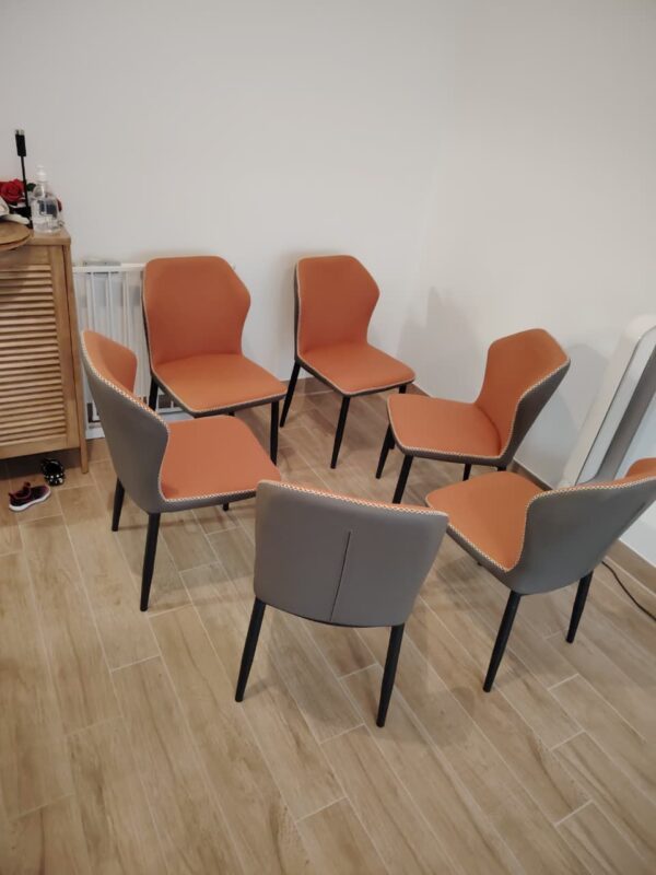 Terracotta Wing Dining Chair — Two-Tone Orange & Slate Grey Leather Chair with Contrast Stitch Detail & Matte Black Tapered Legs | Sold Individually UAE