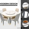 Modern round marble dining table with gold trim and four quilted dining chairs