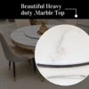 Close-up of the smooth white marble tabletop with polished edge and subtle veining