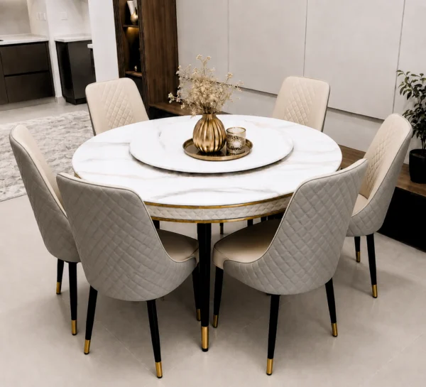 Elegant round marble dining set with six quilted cream chairs and gold trim